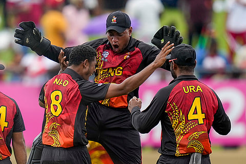 PNG's Kipling Doriga celebrates a wicket